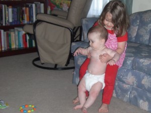 Taken today - notice Kathryn's attention is riveted on the toy, not standing. :)
