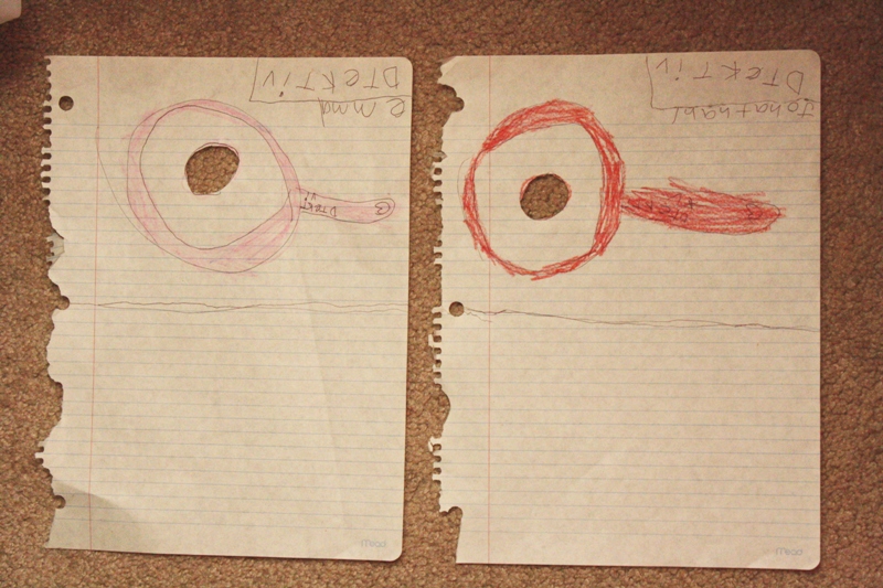 Jonathan and Emma were detectives. I cut out the holes for them (they were originally colored in circles that Jonathan planned to have cut out so they could see through the magnifying glasses. The empty space half of each paper is for them to write down what they see.