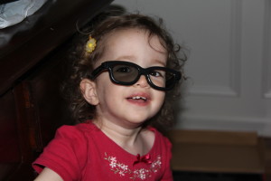 Abby also loves glasses.  These were old 3D glasses that Abby found and wore around the house.  :)